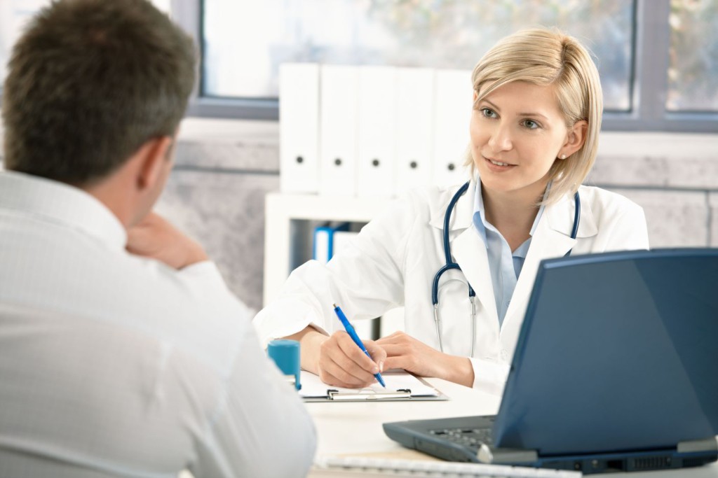 A stock photo of a patient consulting doctor.