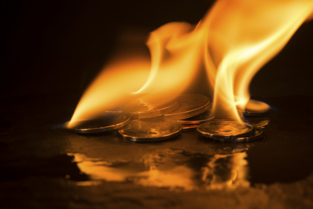 A small pile of coins on fire