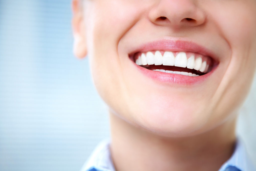 Close-up of female smile with healthy teeth